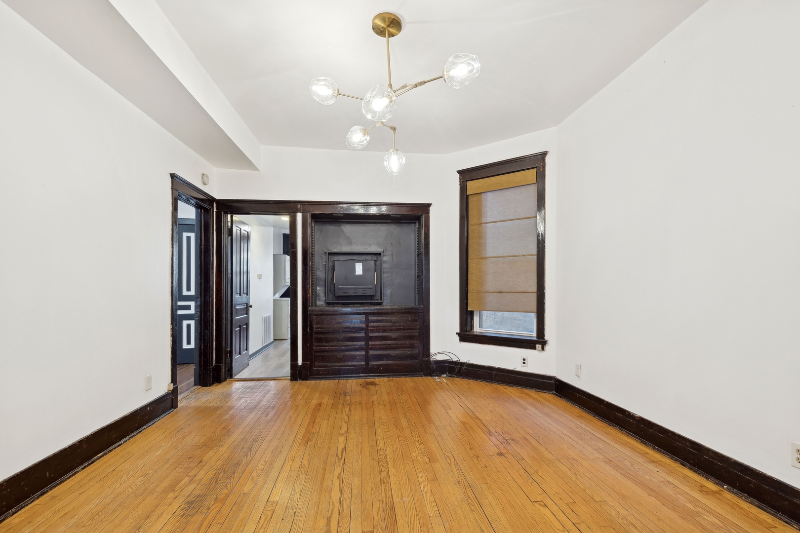 949 North Damen Avenue Chicago, IL 60622 - Photo 14 of 28 wooden floor in an empty room with a window