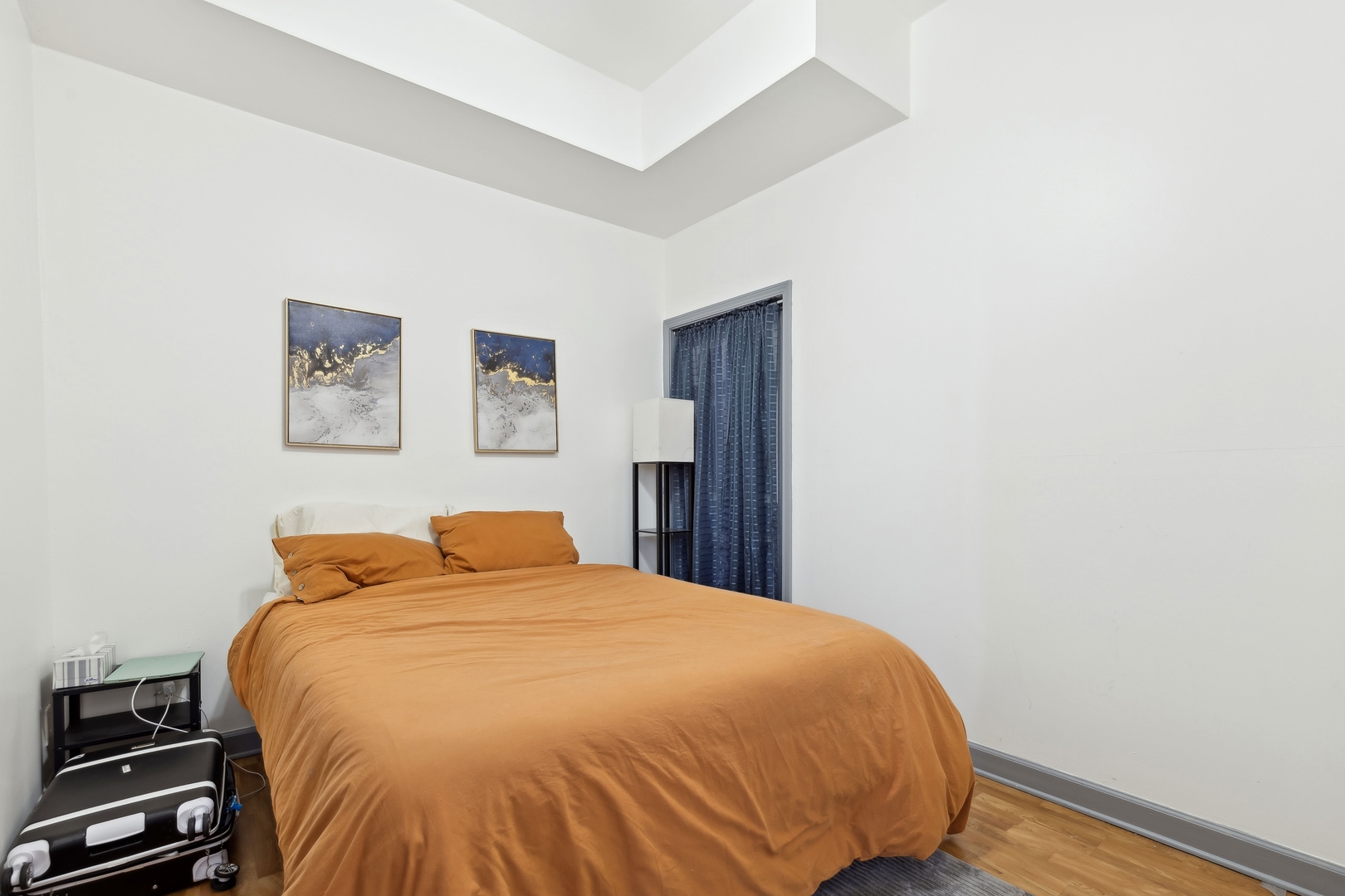 949 North Damen Avenue Chicago, IL 60622 - Photo 26 of 28 a bedroom with a bed and cupboard