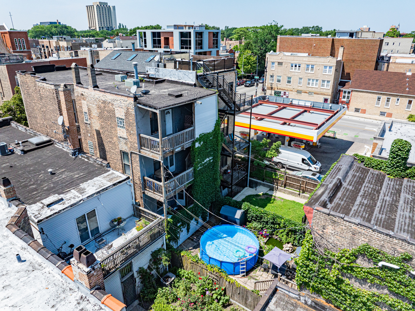 949 North Damen Avenue Chicago, IL 60622 - Photo 3 of 28 an aerial view of a house with a swimming pool and outdoor seating