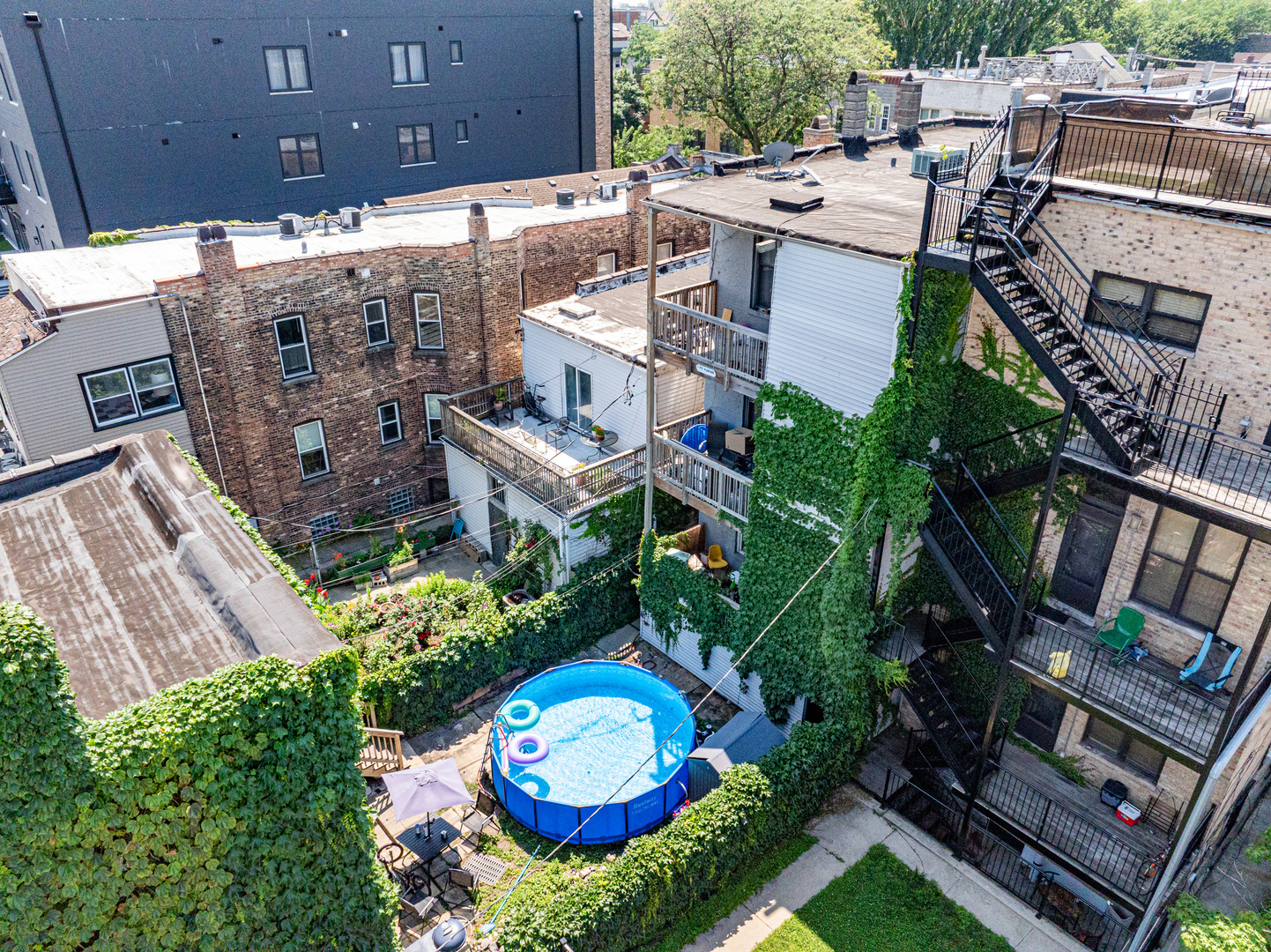 949 North Damen Avenue Chicago, IL 60622 - Photo 4 of 28 an aerial view of a house with a yard basket ball court and outdoor seating