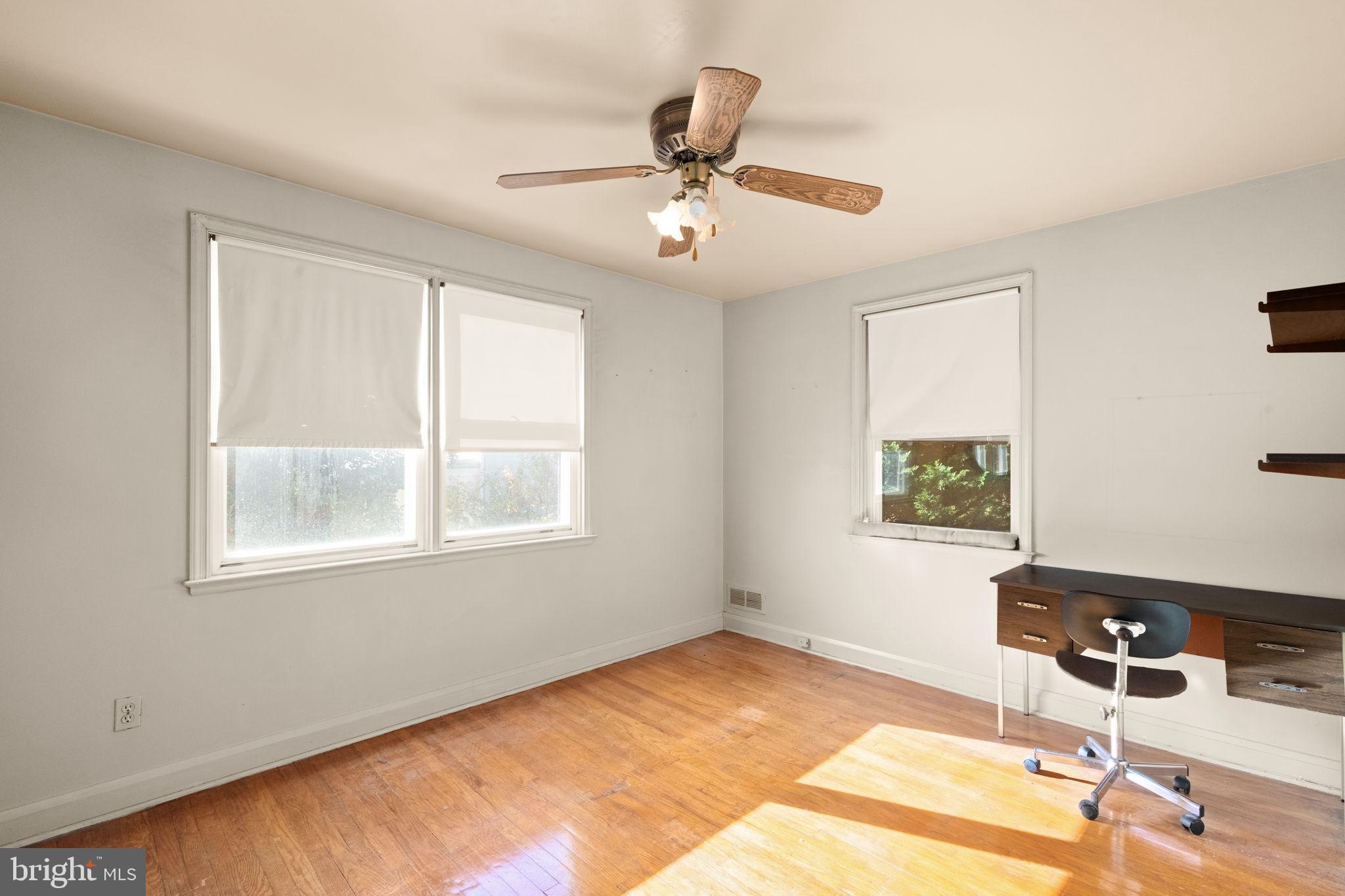 6822 Everall Avenue Baltimore, MD 21206 - Photo 14 of 21 a view of a workspace with furniture and a window