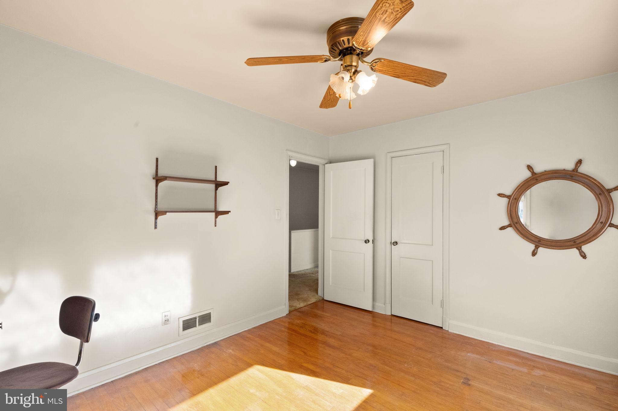 6822 Everall Avenue Baltimore, MD 21206 - Photo 15 of 21 a view of a room with wooden floor and bathroom