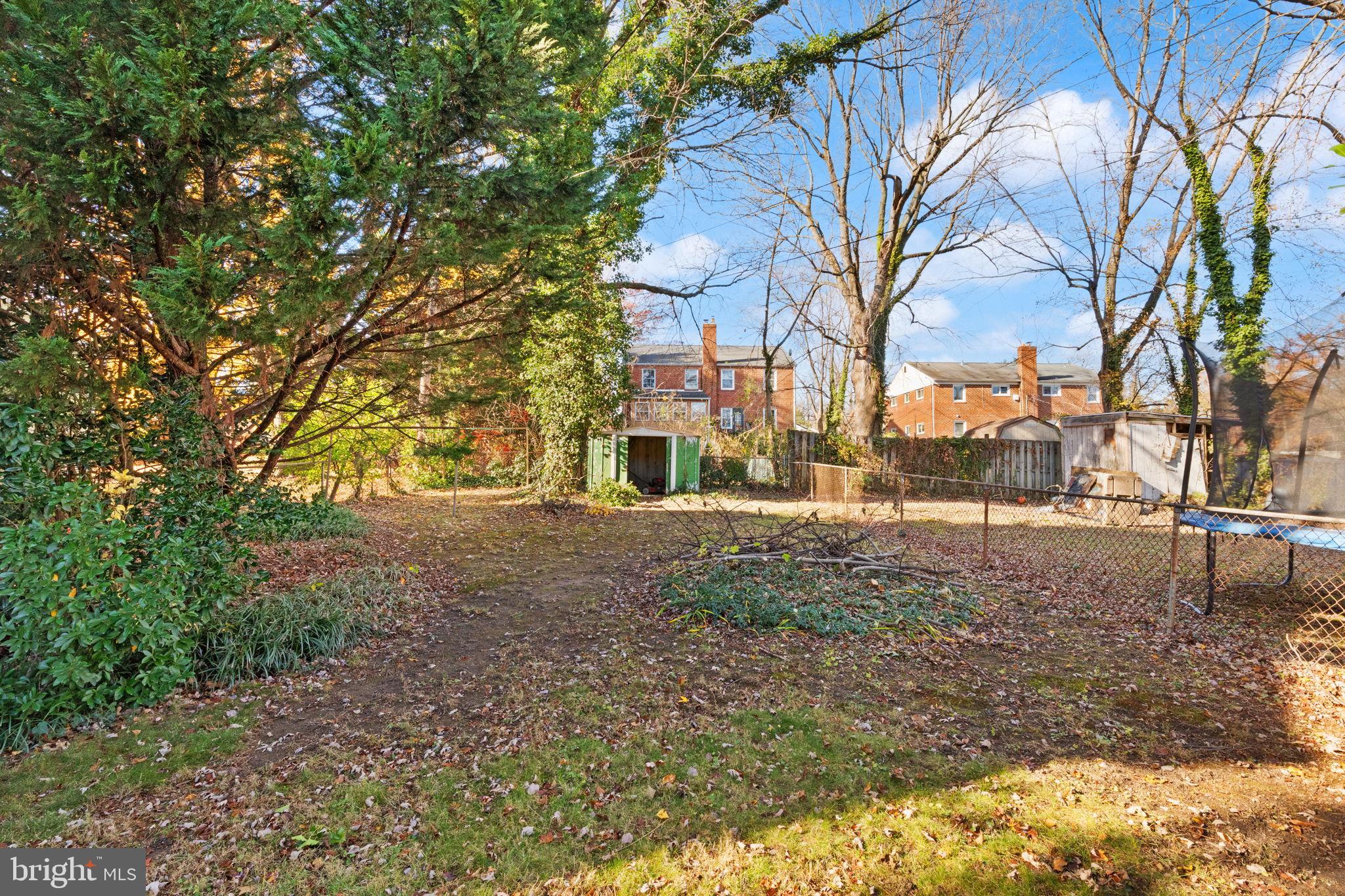 6822 Everall Avenue Baltimore, MD 21206 - Photo 19 of 21 a backyard of a house with large trees