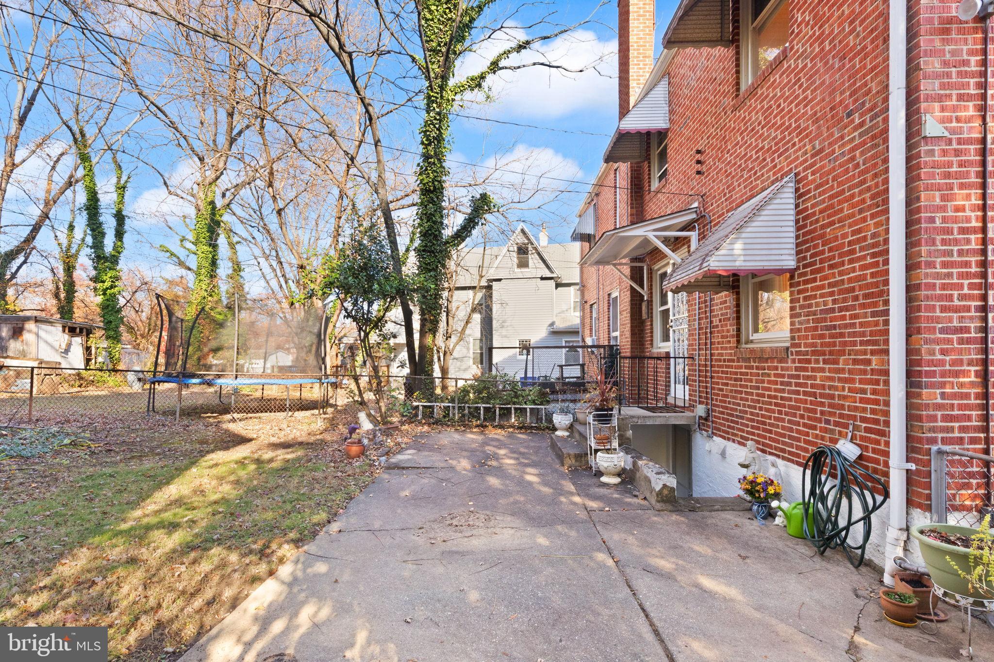 6822 Everall Avenue Baltimore, MD 21206 - Photo 20 of 21 a backyard of a house with outdoor seating