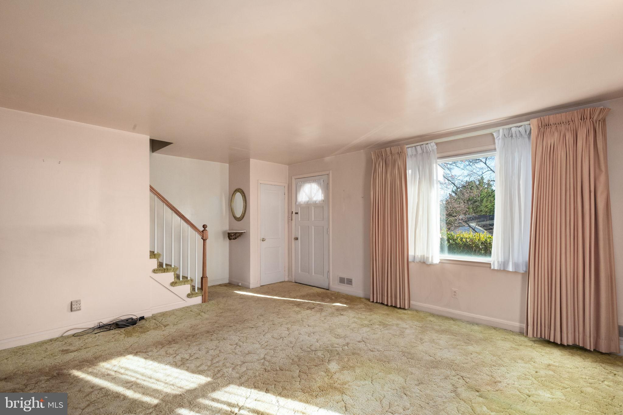 6822 Everall Avenue Baltimore, MD 21206 - Photo 4 of 21 a view of a livingroom with an empty space and a window