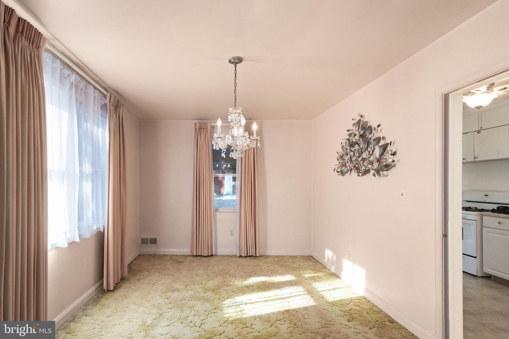 6822 Everall Avenue Baltimore, MD 21206 - Photo 6 of 21 a view of a chandelier in a room