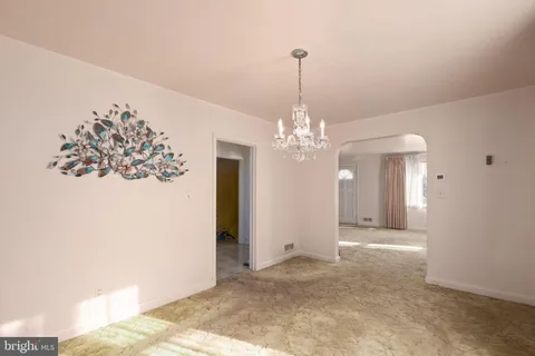 a spacious bathroom with a granite countertop sink a mirror and a