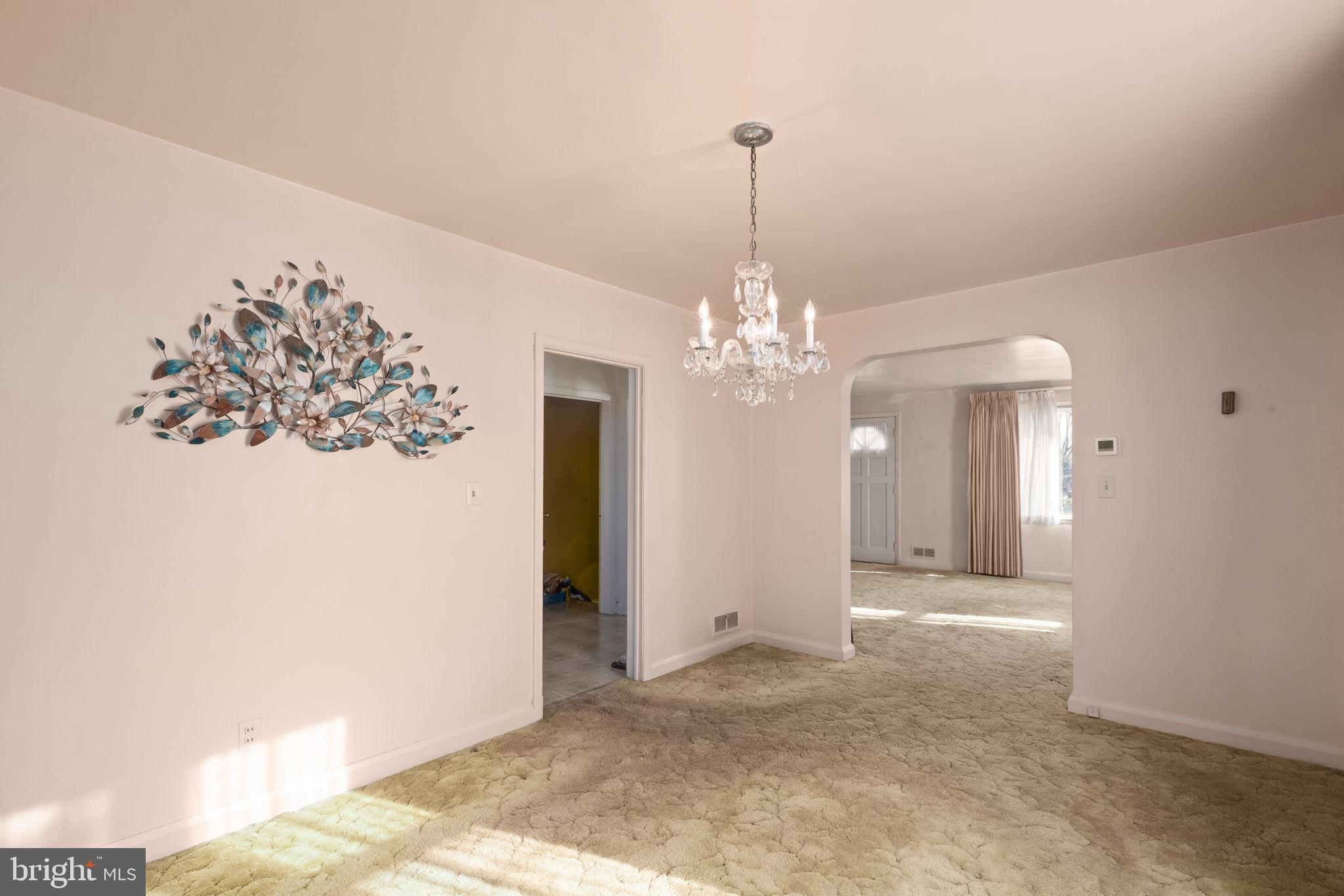 6822 Everall Avenue Baltimore, MD 21206 - Photo 7 of 21 a view of a chandelier in big room and chandelier