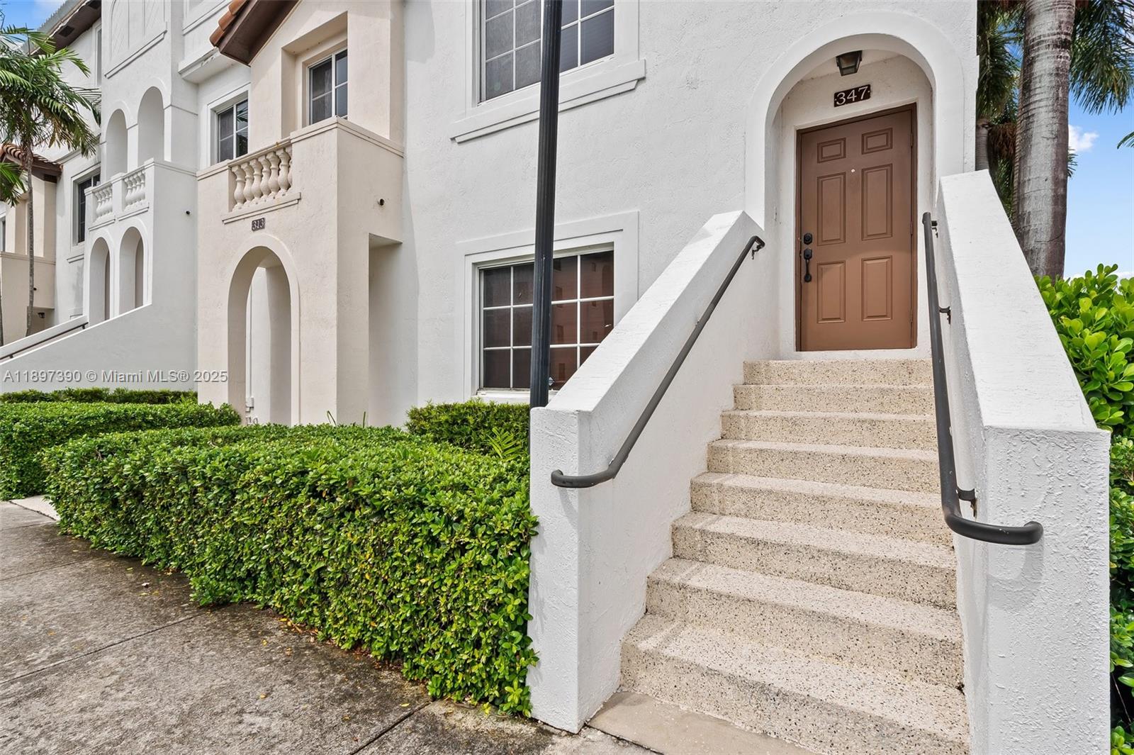 12421 Southwest 50th Court, Unit 347 Miramar, FL 33027 - Photo 2 of 25 a view of a building with entryway and door