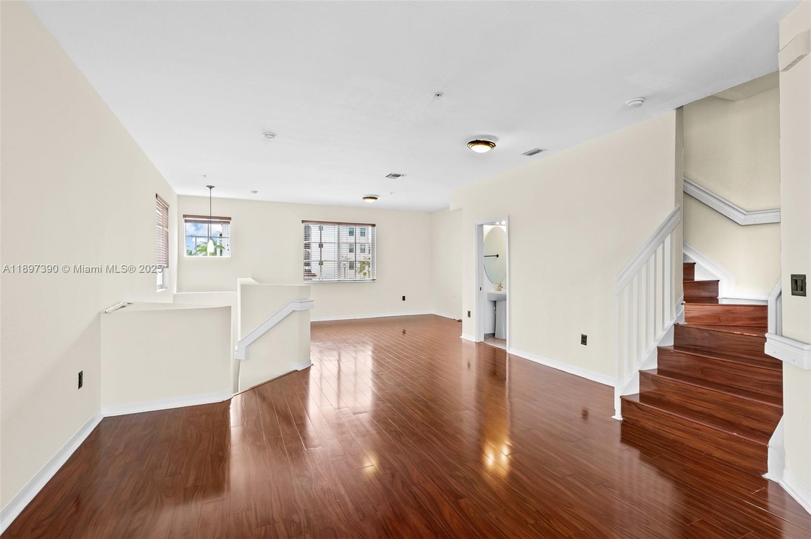 12421 Southwest 50th Court, Unit 347 Miramar, FL 33027 - Photo 21 of 25 a view of entryway and hall with wooden floor