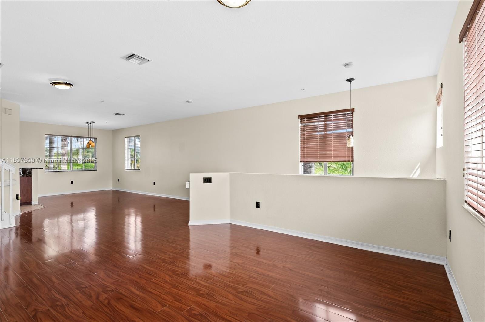 12421 Southwest 50th Court, Unit 347 Miramar, FL 33027 - Photo 23 of 25 a view of a room with wooden floors and window