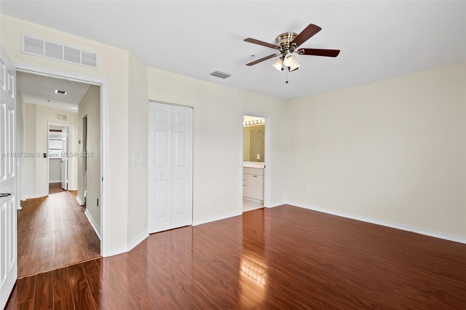 12421 Southwest 50th Court, Unit 347 Miramar, FL 33027 - Photo 3 of 25 wooden floor in an empty room with a window