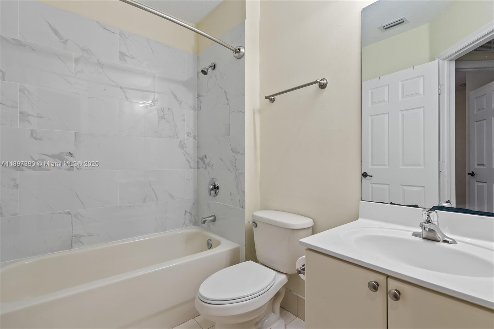 12421 Southwest 50th Court, Unit 347 Miramar, FL 33027 - Photo 9 of 25 a bathroom with a sink a toilet and a bathtub