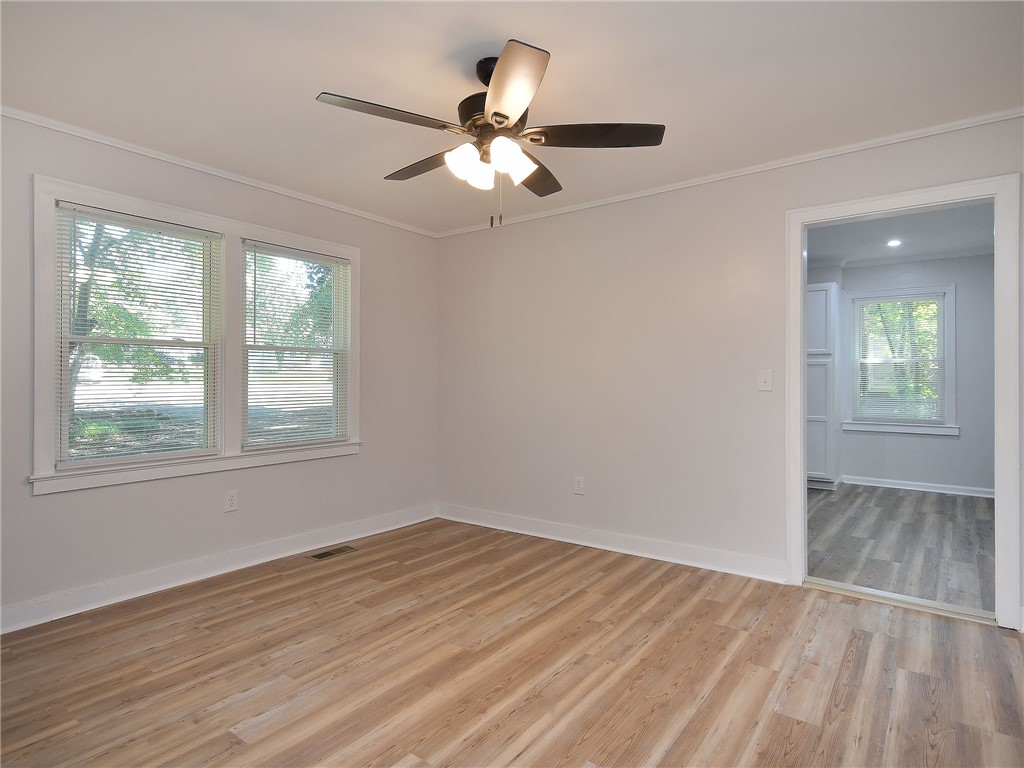 3517 Shawnee Avenue Anderson, SC 29626 - Photo 17 of 25 Laminate wood flooring and bright windows create an inviting atmosphere for any use.