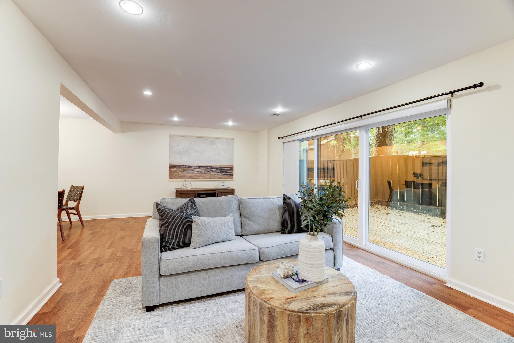 11102 Saffold Way Reston, VA 20190 - Photo 15 of 27 a living room with furniture and a large window