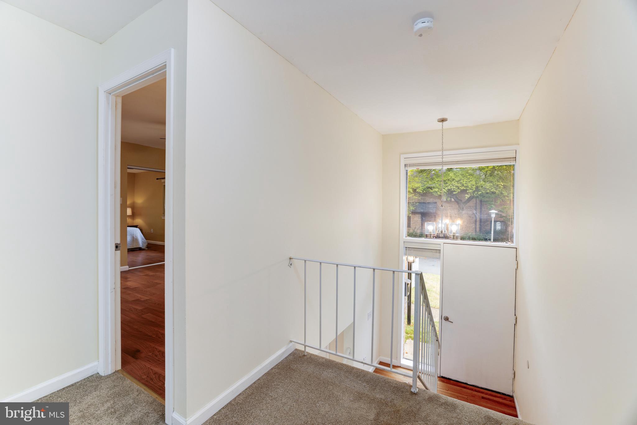 11102 Saffold Way Reston, VA 20190 - Photo 19 of 27 a view of an entryway with wooden floor