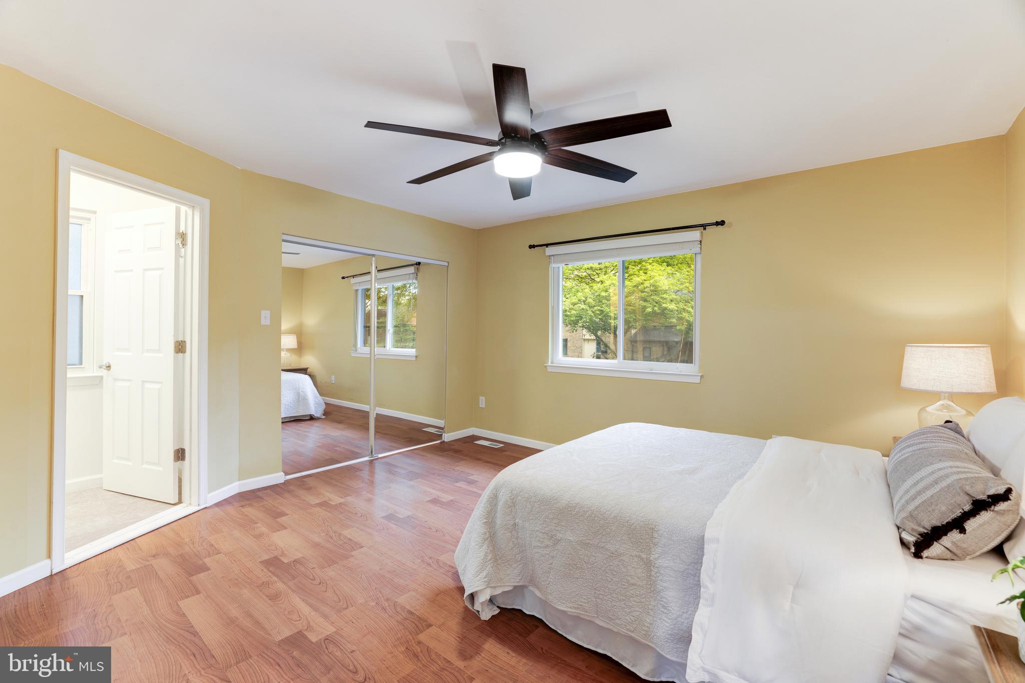 11102 Saffold Way Reston, VA 20190 - Photo 22 of 27 a bedroom with a large bed and a window