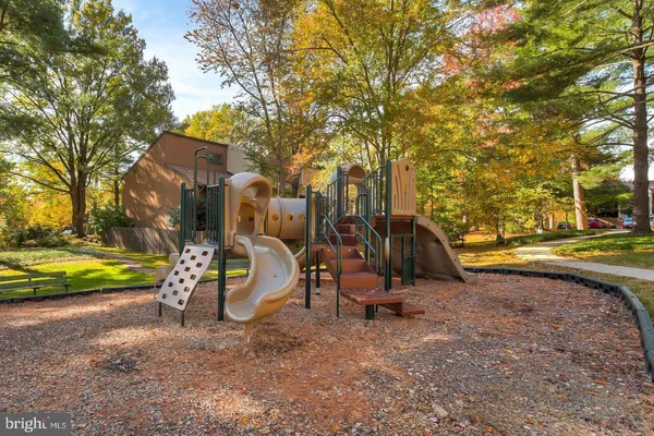 a view of a park with swings and slides