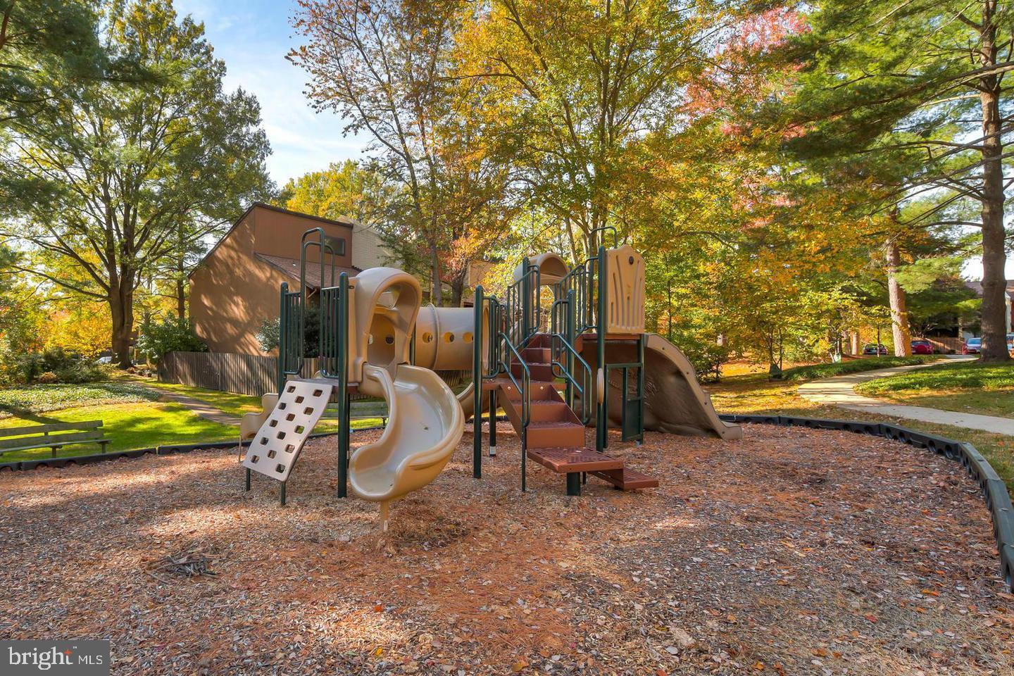 11102 Saffold Way Reston, VA 20190 - Photo 27 of 27 a view of a park with swings and slides