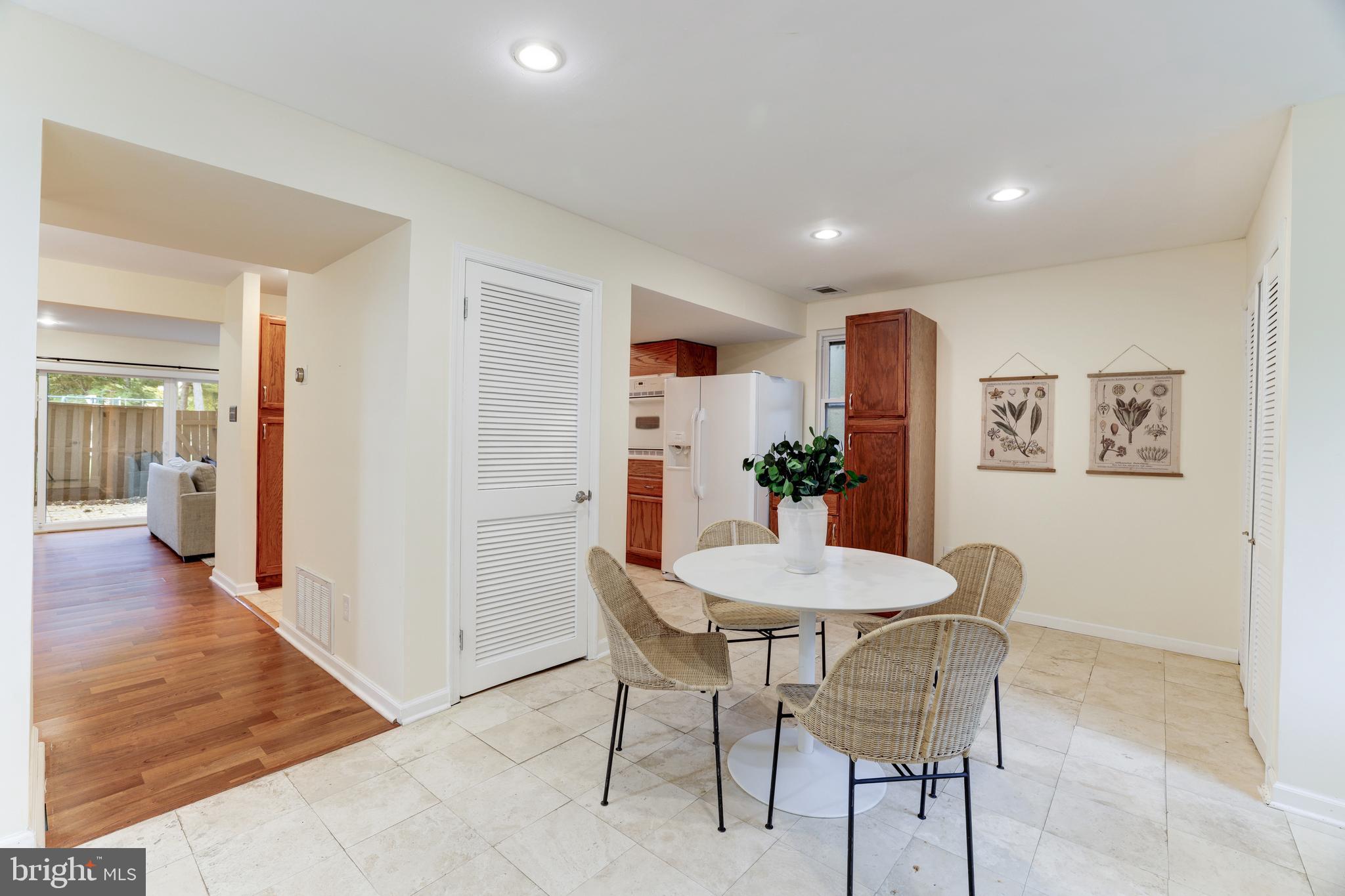 11102 Saffold Way Reston, VA 20190 - Photo 3 of 27 a view of a dining room with furniture