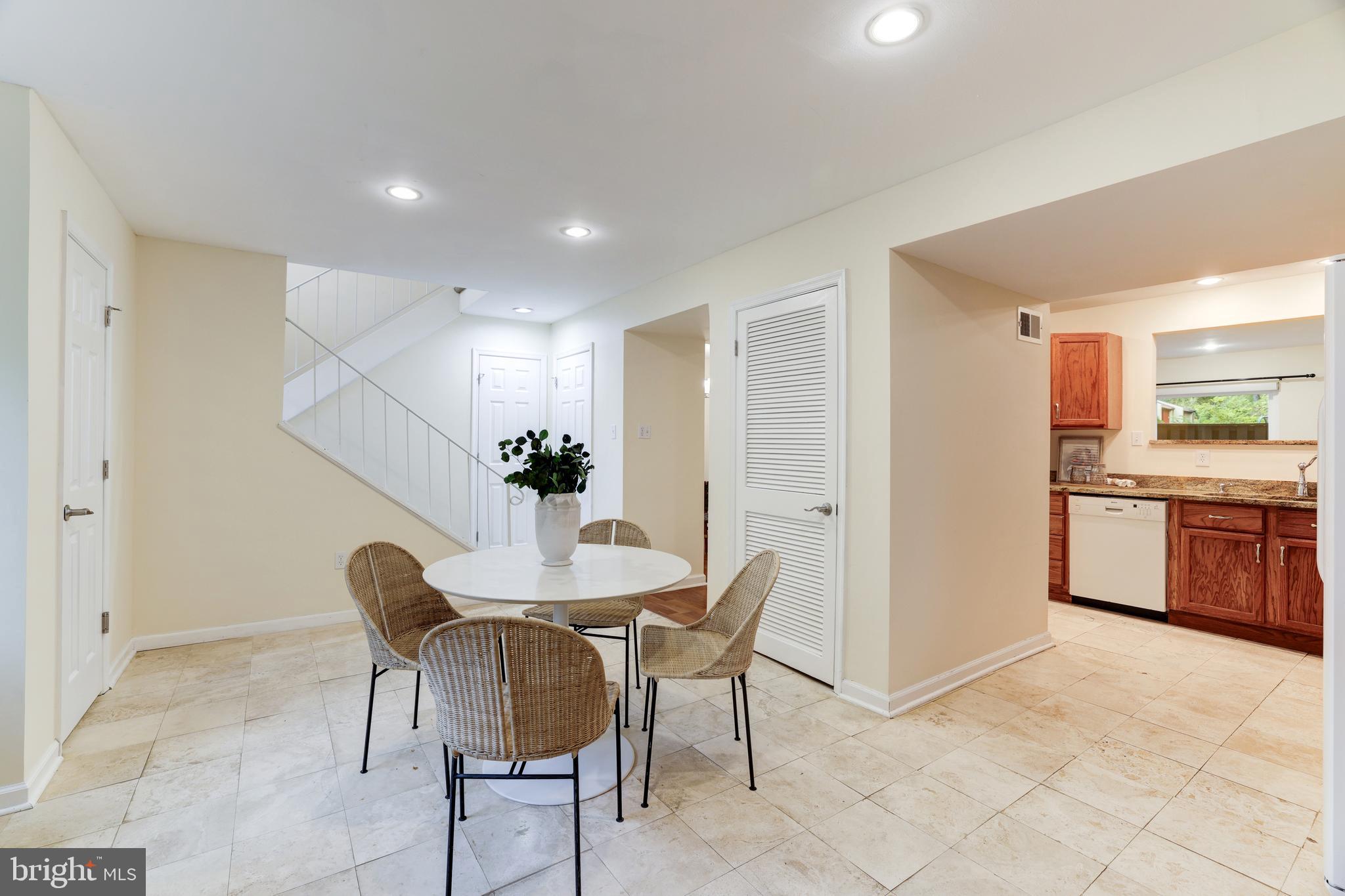 11102 Saffold Way Reston, VA 20190 - Photo 5 of 27 a view of a dining room with furniture and a chandelier