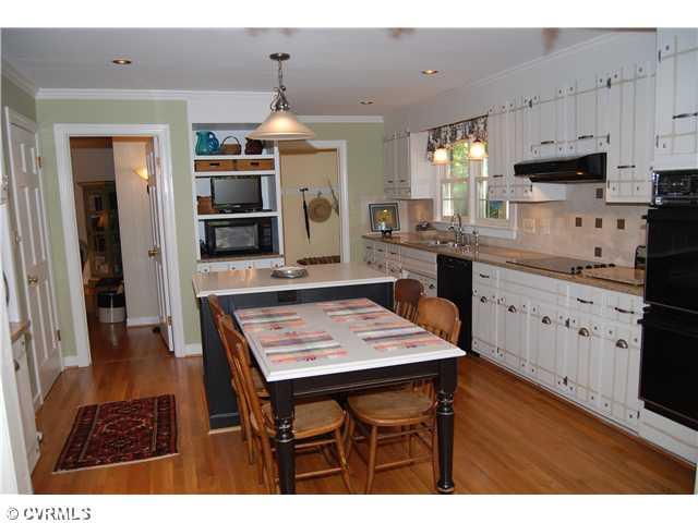 3919 Cresthill Road Chester, VA 23831 - Photo 4 of 7 Exterior Front - Newly renovated kitchen W/engineered granite & marble counter tops & new custom cabinettes. Pull out recycling bins, double ovens, cook top, 2 pantrys & hardwood floors are a few of its wonderful features. Open to dining area & adjoins family room.