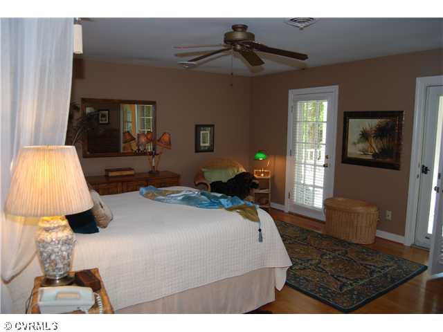 3919 Cresthill Road Chester, VA 23831 - Photo 5 of 7 Master Bedroom - Master BR with 2 doors leading to upper porch with hammock & swing. Open the doors to enoy the breeze or enjoy lounging in the hammock.