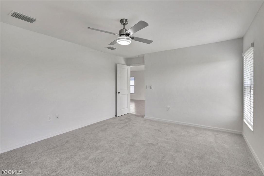 19931 Green Pasture Road Lehigh Acres, FL 33974 - Photo 12 of 19 a view of an empty room with a window