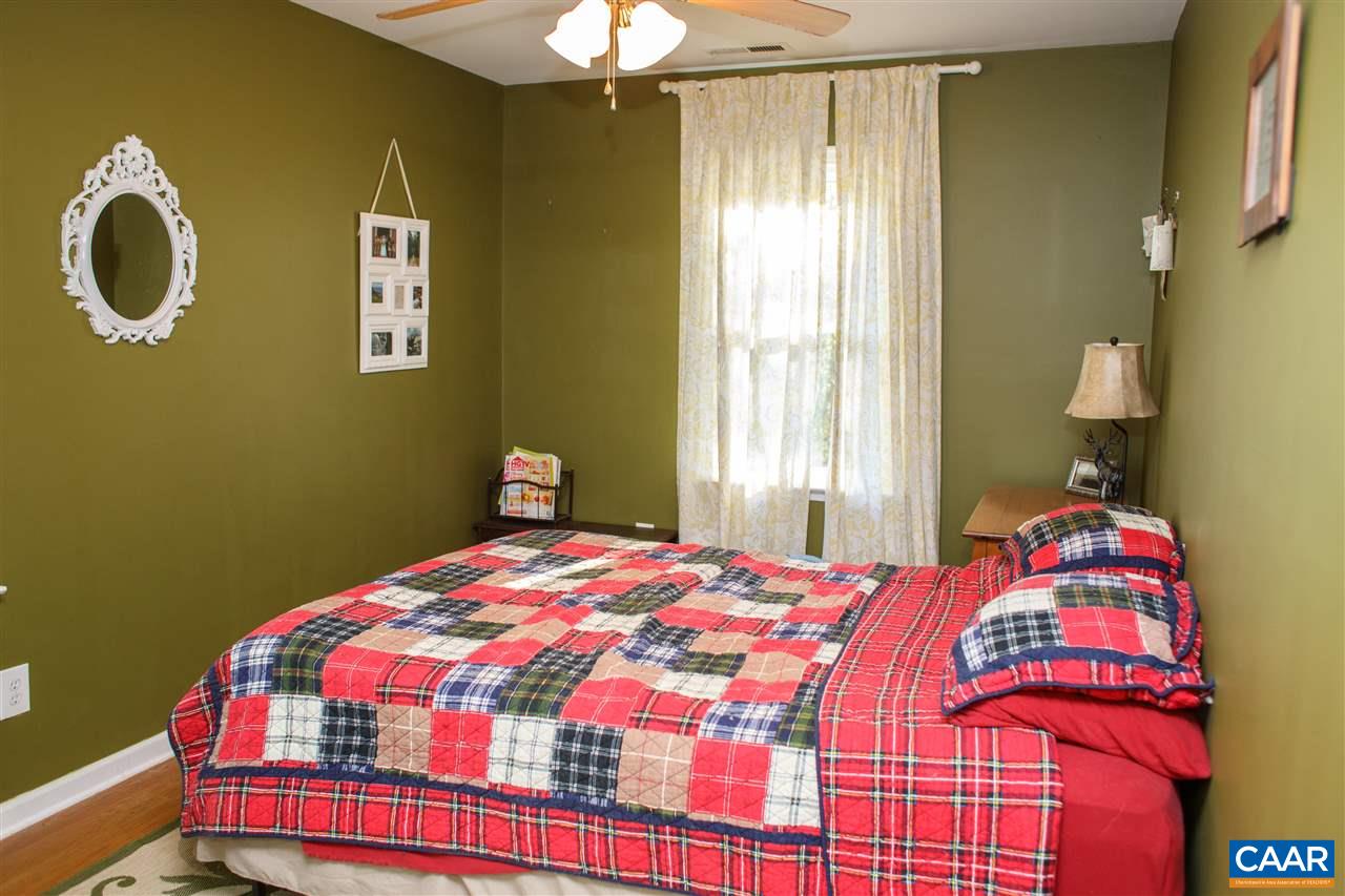 207 West Daffodil Road Ruckersville, VA 22968 - Photo 7 of 21 a bedroom with a bed and a window