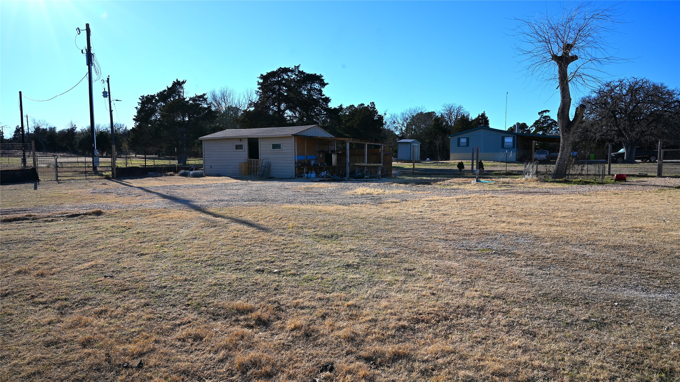 155 Arbuckle Road Elgin, TX 78621 - Photo 19 of 35 a view of a house with a yard