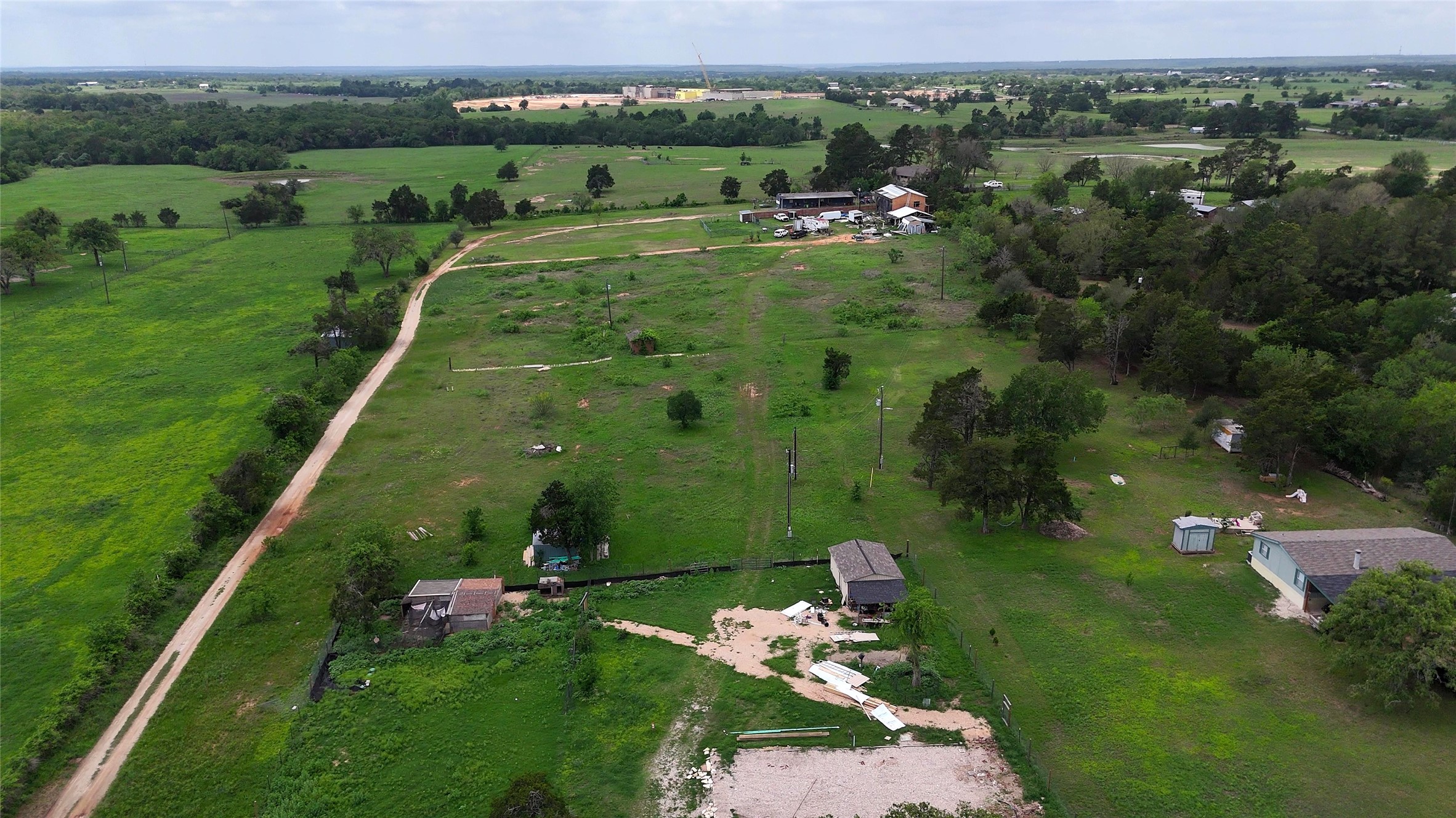 155 Arbuckle Road Elgin, TX 78621 - Photo 2 of 35 an aerial view of a golf course with parking space