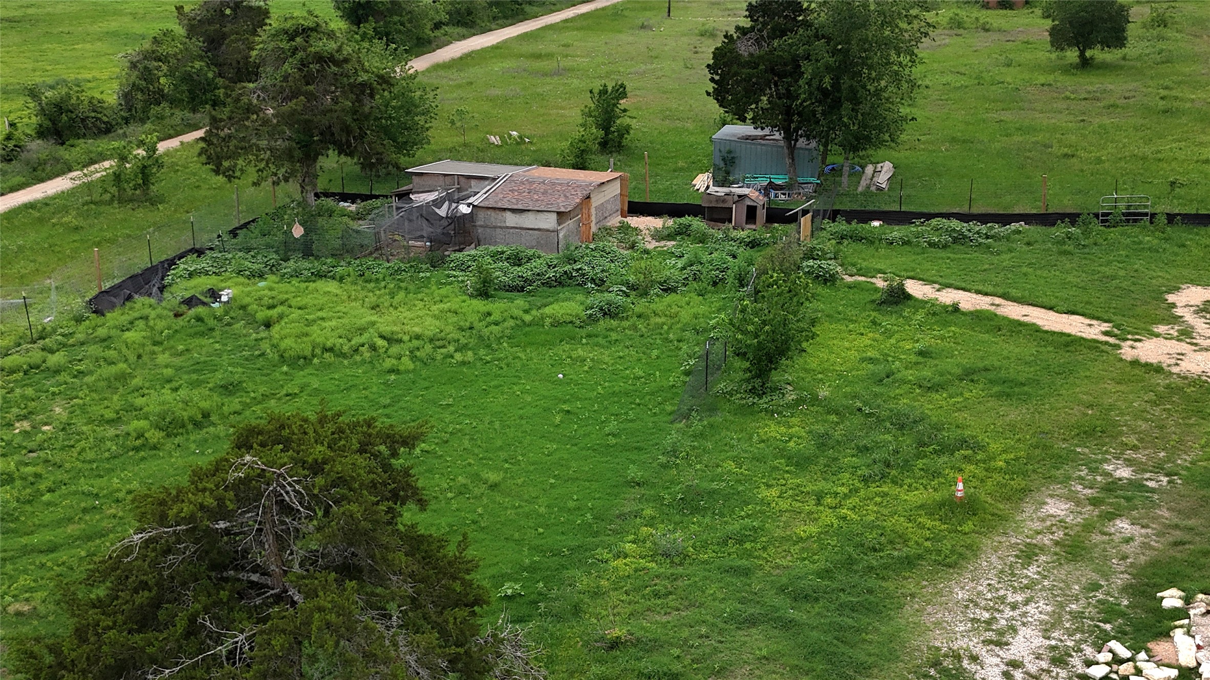 155 Arbuckle Road Elgin, TX 78621 - Photo 21 of 35 an aerial view of a house with pool outdoor seating and yard