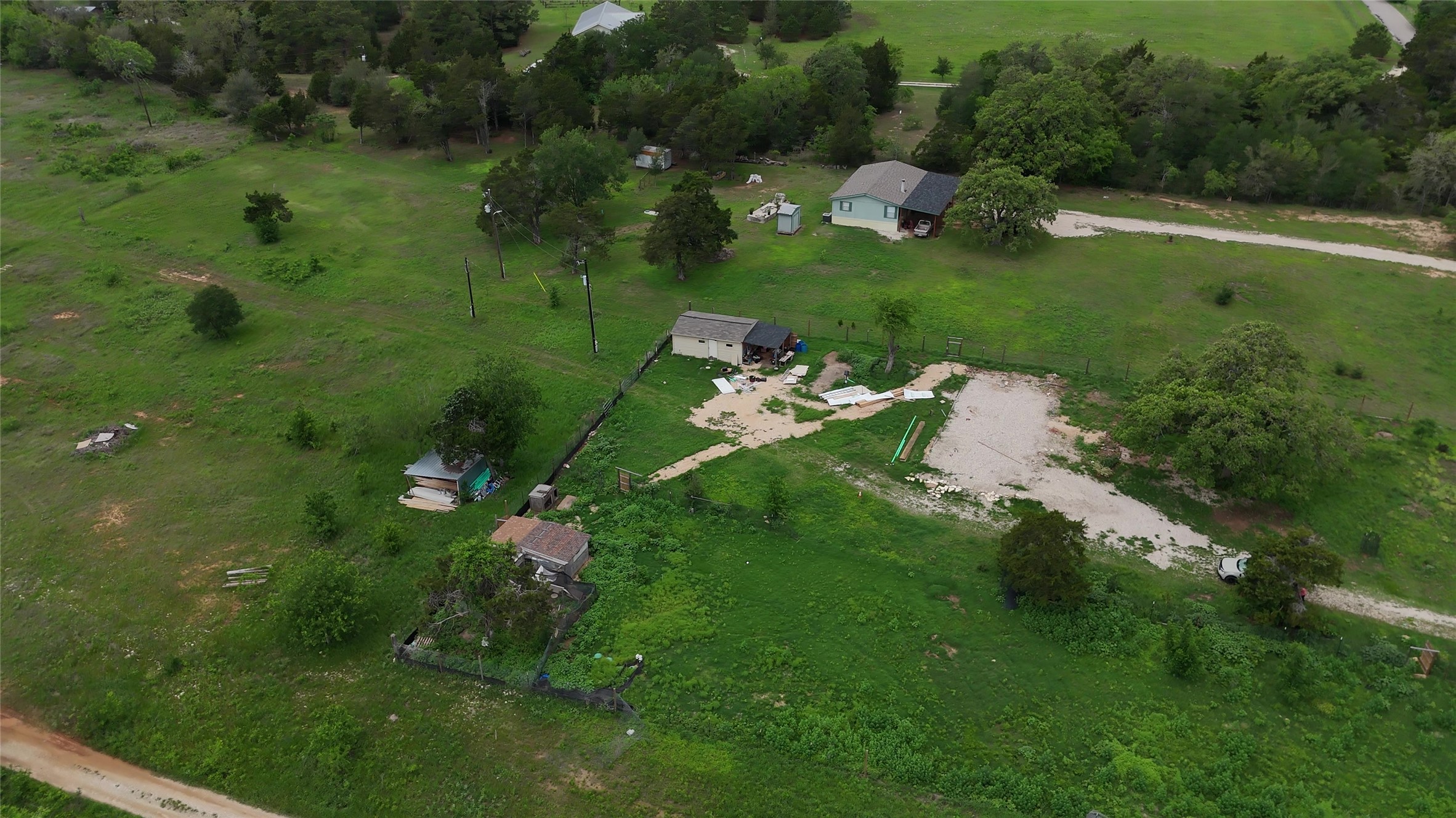 155 Arbuckle Road Elgin, TX 78621 - Photo 25 of 35 a view of a golf course with a lake