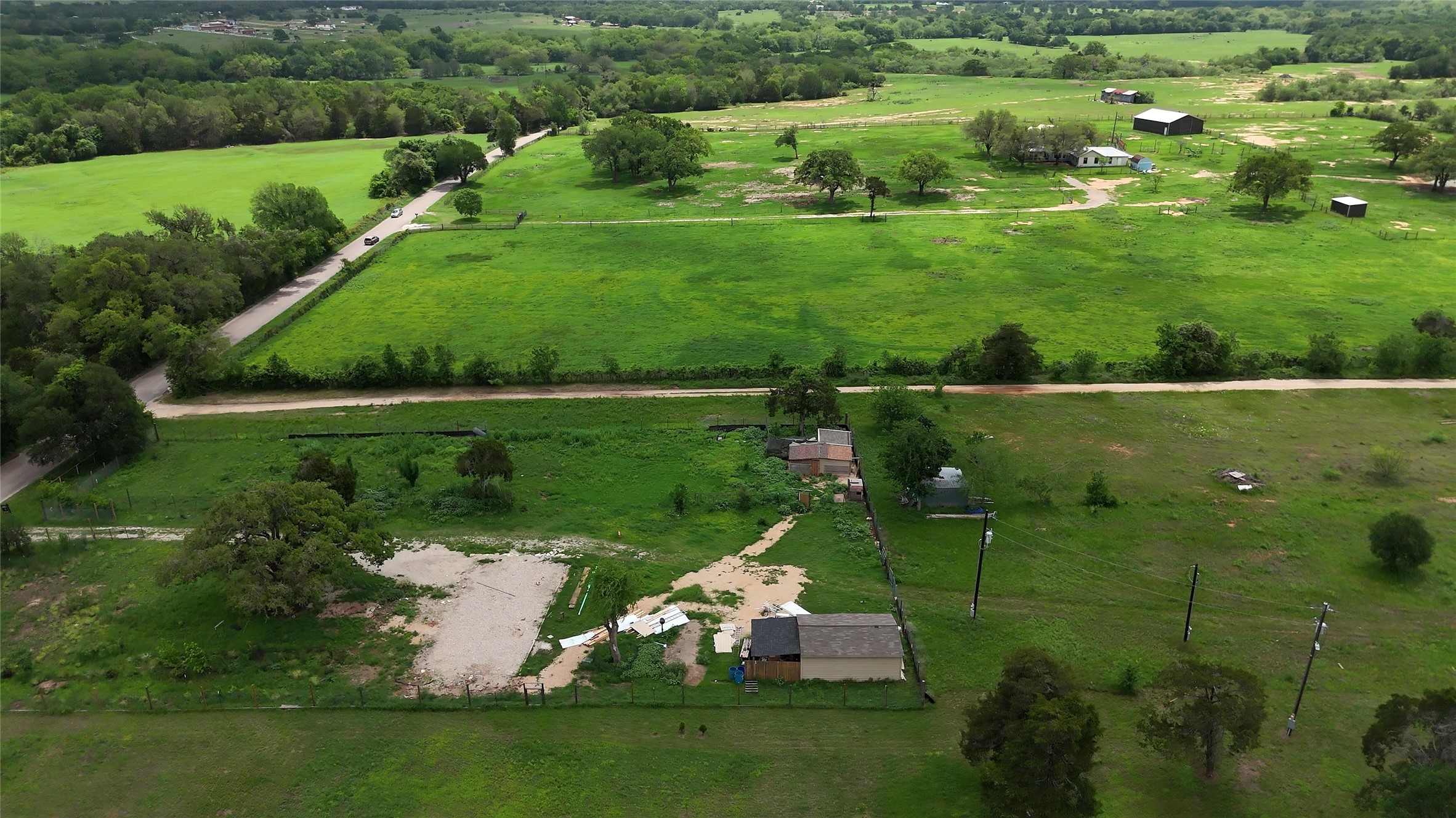 155 Arbuckle Road Elgin, TX 78621 - Photo 27 of 35 a view of a golf course with a lake