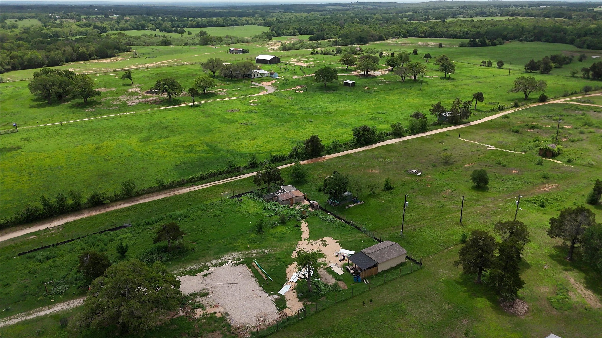 155 Arbuckle Road Elgin, TX 78621 - Photo 28 of 35 an aerial view of a golf course with parking space