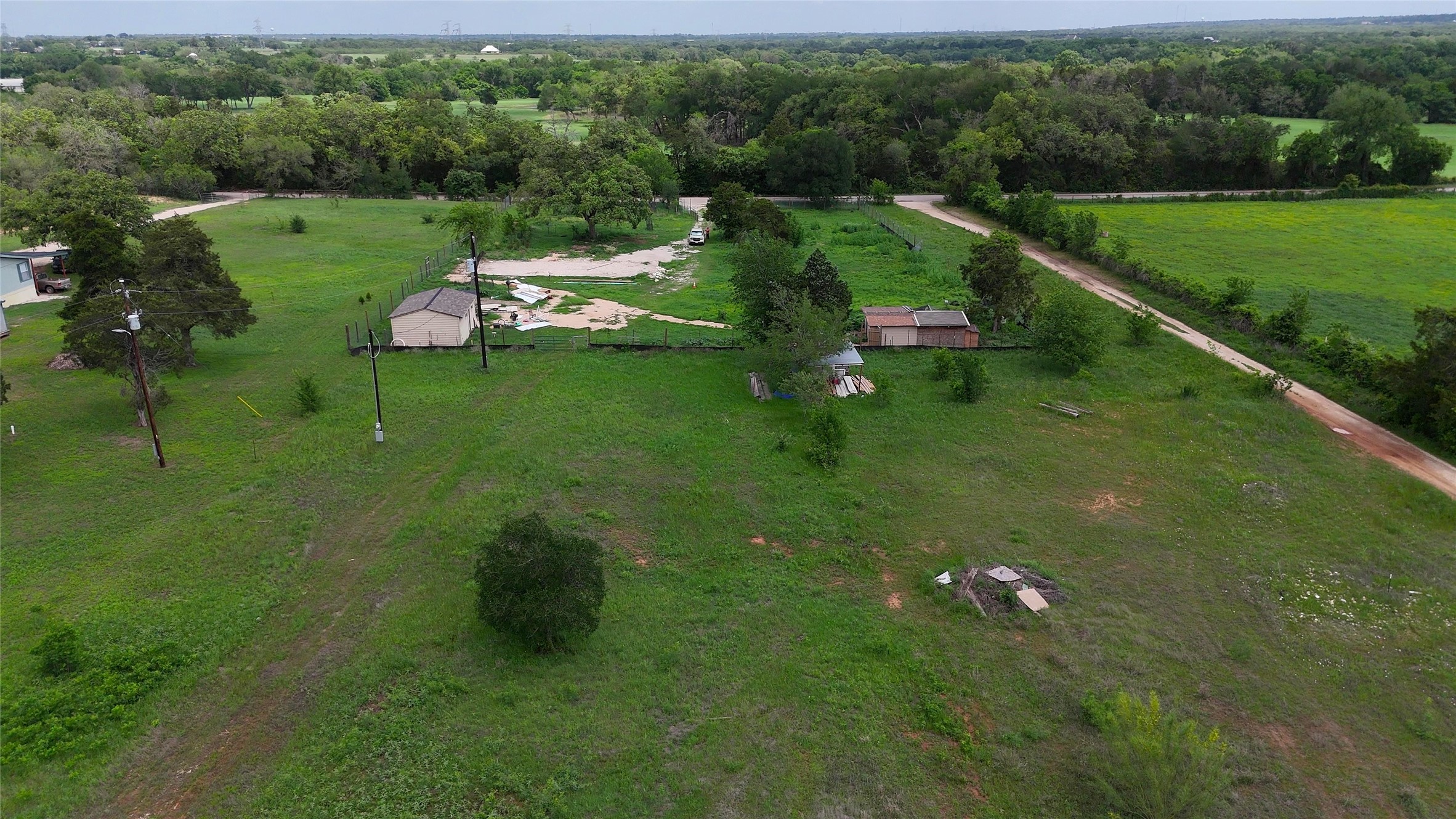 155 Arbuckle Road Elgin, TX 78621 - Photo 29 of 35 a aerial view of a house with a yard