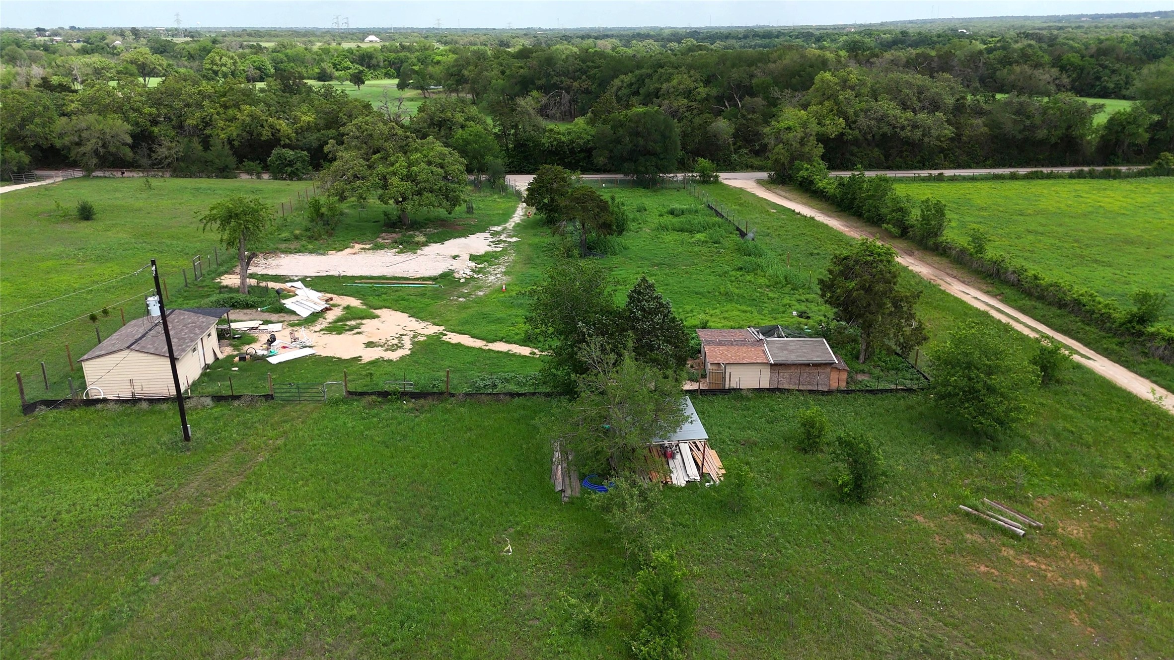 155 Arbuckle Road Elgin, TX 78621 - Photo 30 of 35 a view of a garden with a lake view