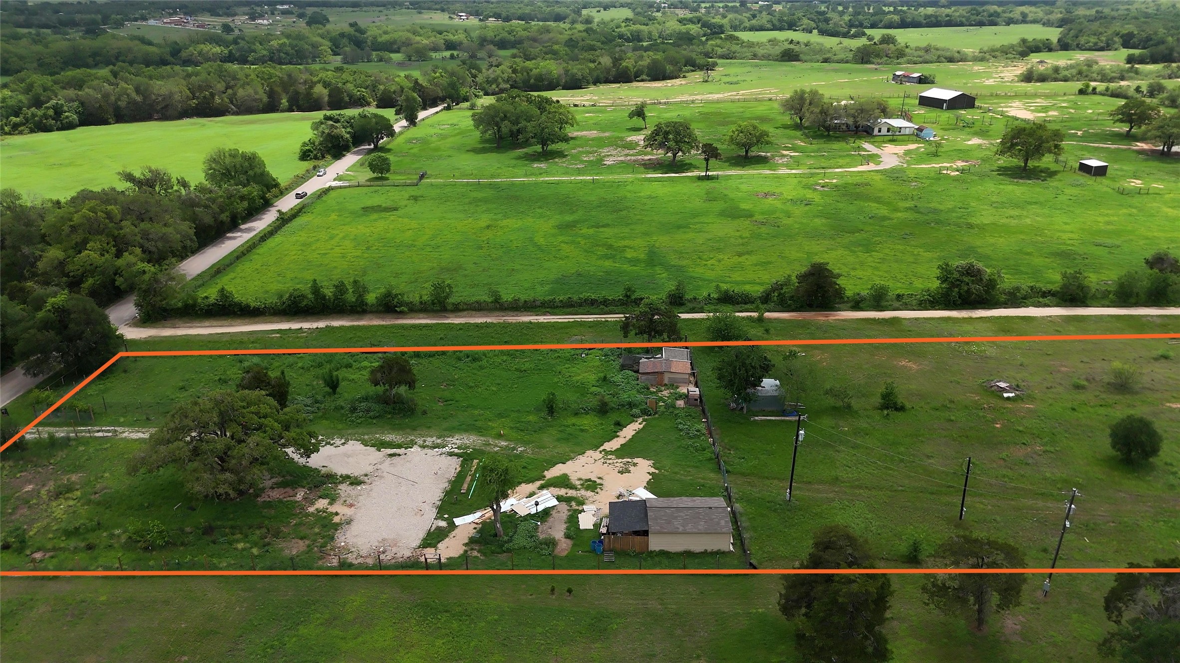 155 Arbuckle Road Elgin, TX 78621 - Photo 3 of 35 a view of a golf course with a lake