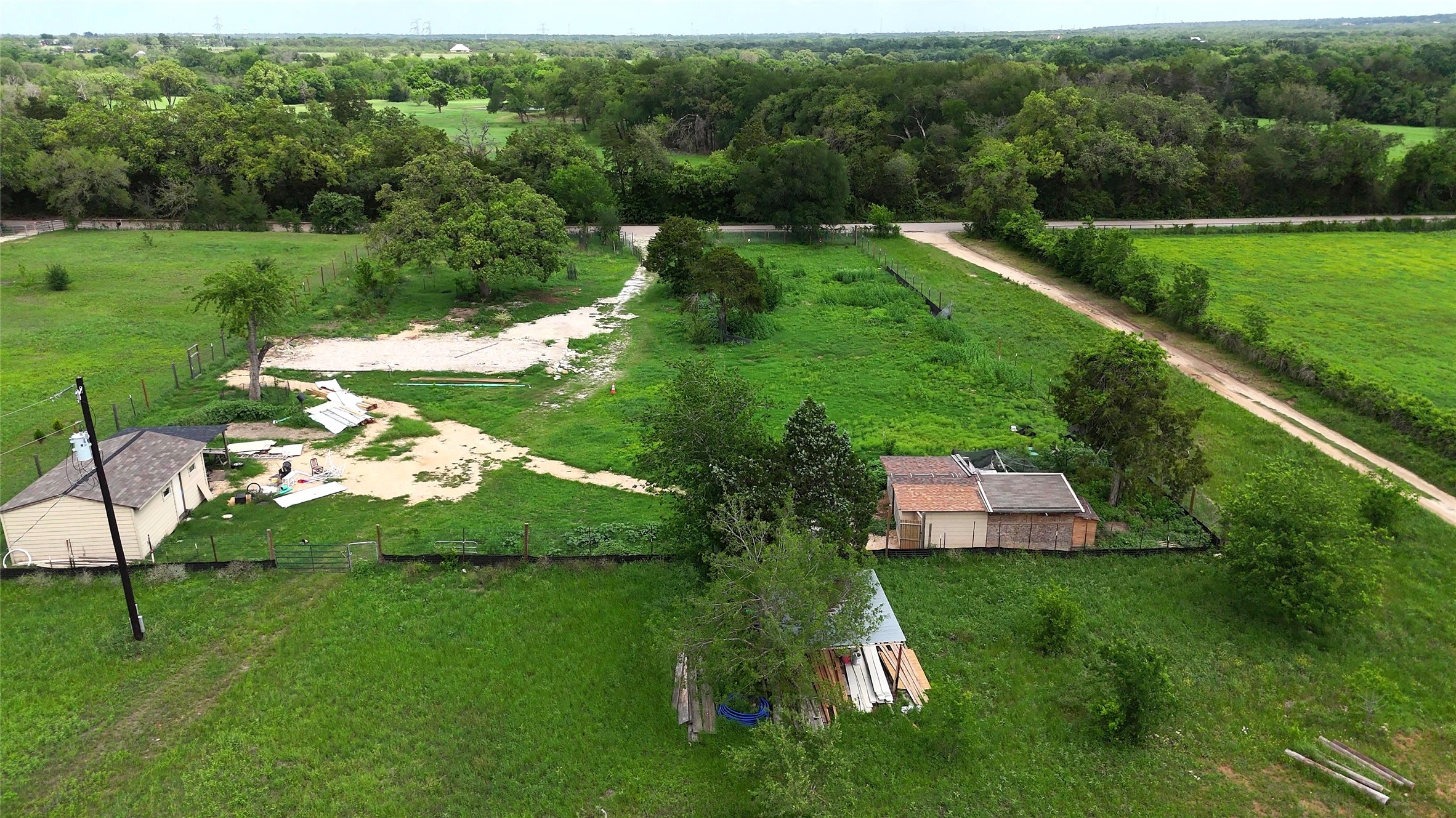155 Arbuckle Road Elgin, TX 78621 - Photo 31 of 35 a view of a golf course with a lake