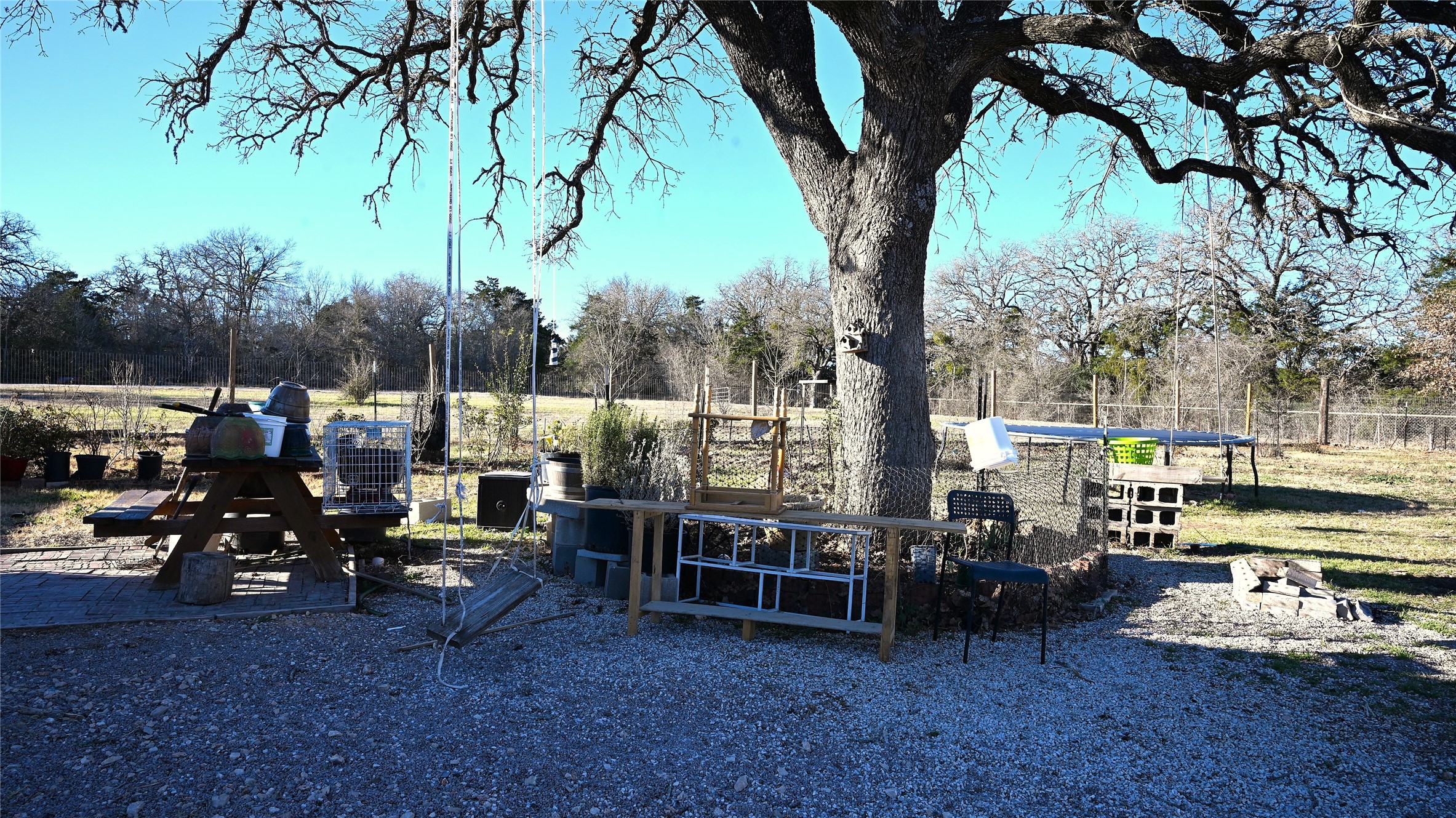 155 Arbuckle Road Elgin, TX 78621 - Photo 34 of 35 a view of outdoor space with seating area and trees