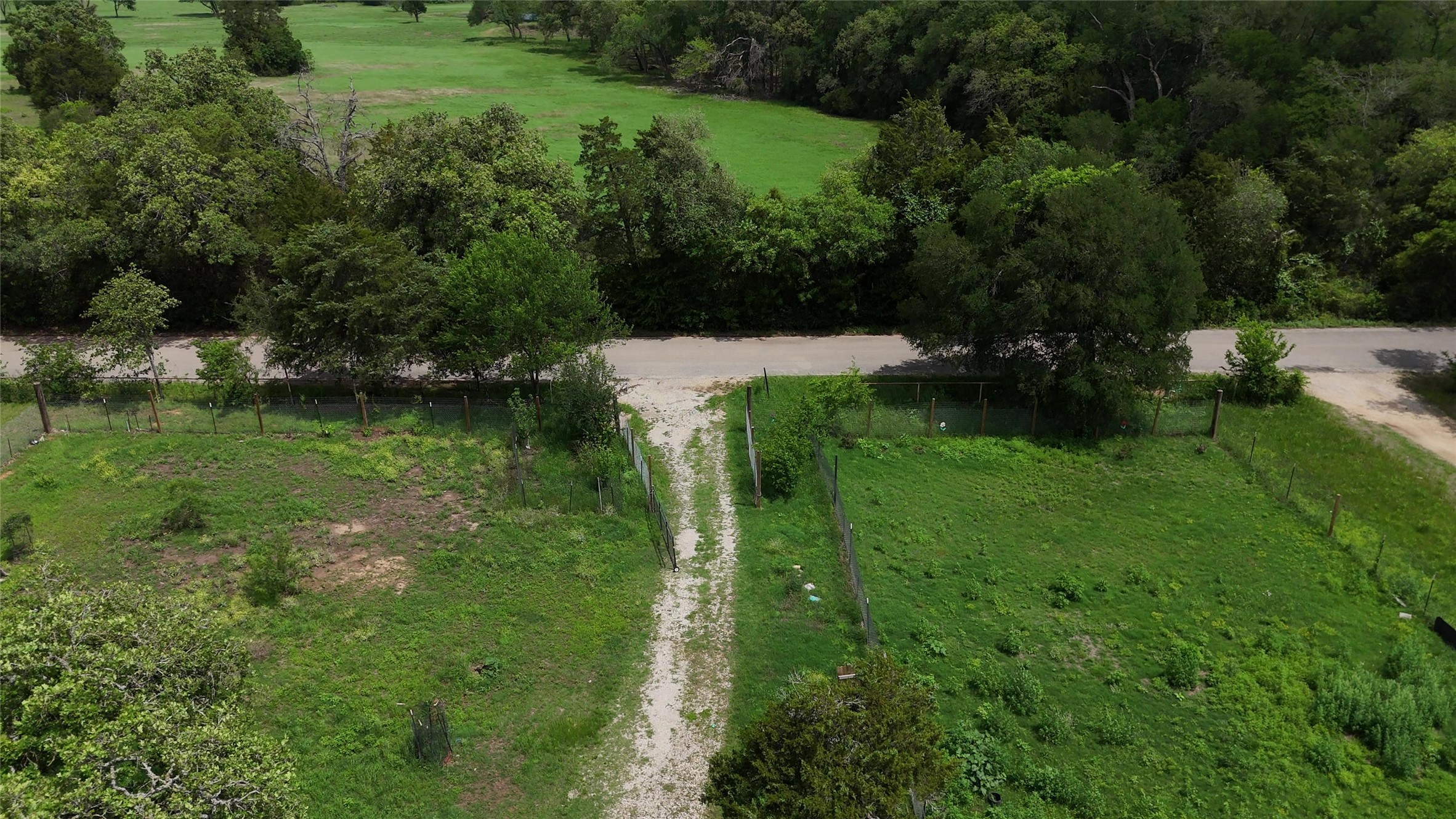 155 Arbuckle Road Elgin, TX 78621 - Photo 7 of 35 a view of a green yard