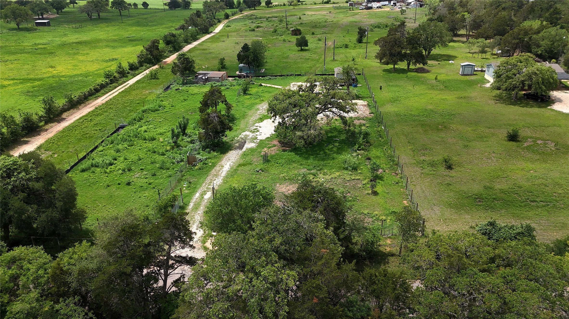 155 Arbuckle Road Elgin, TX 78621 - Photo 9 of 35 a large green field with lots of green space