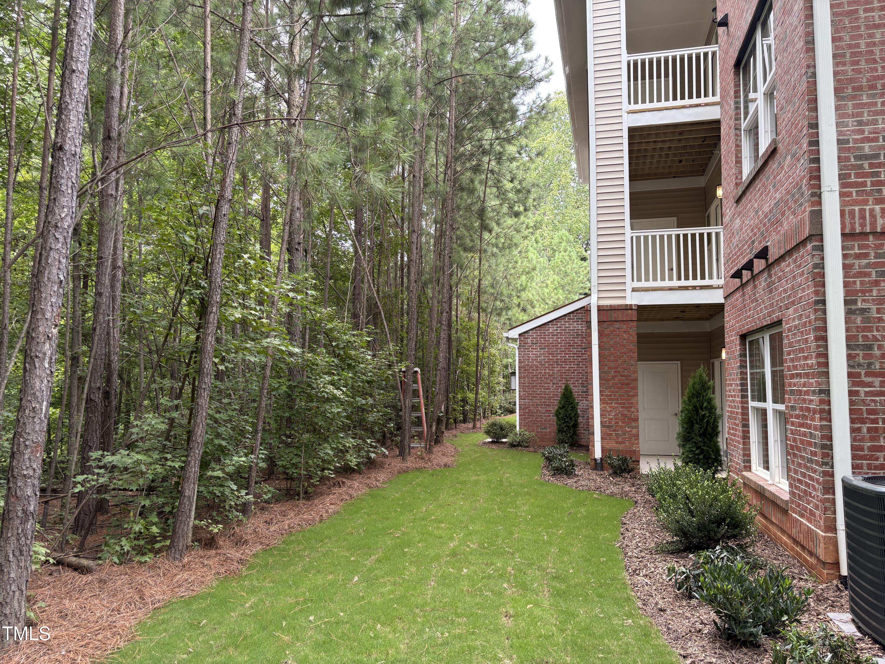 602 Weather Ridge Lane, Unit 21 Cary, NC 27513 - Photo 17 of 19 a view of a house with backyard and garden