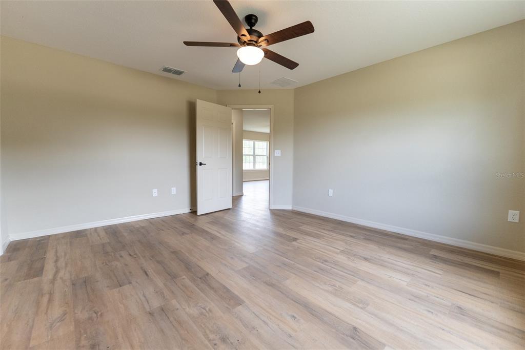 23855 Southwest White Sands Road Dunnellon, FL 34431 - Photo 13 of 42 wooden floor in an empty room