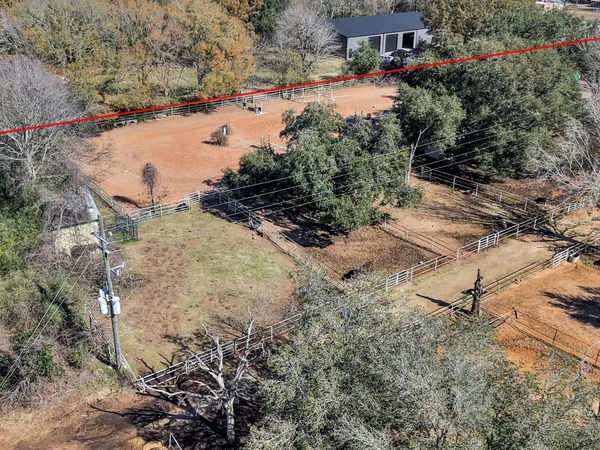 a sign board with wooden fence