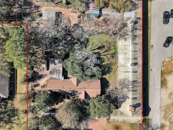 an aerial view of a house with outdoor space