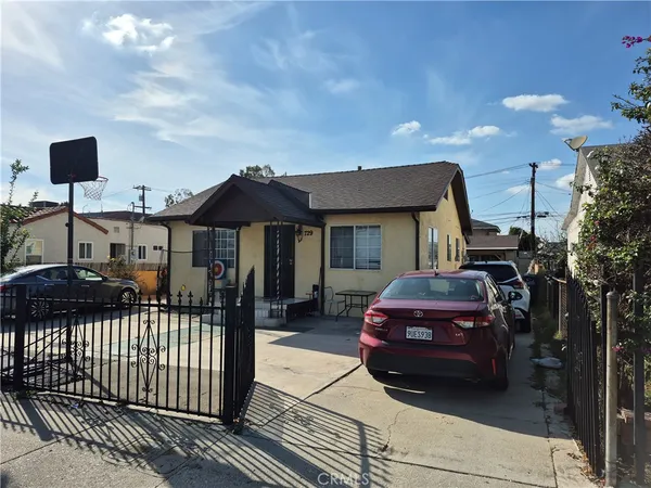 a front view of a house with parking