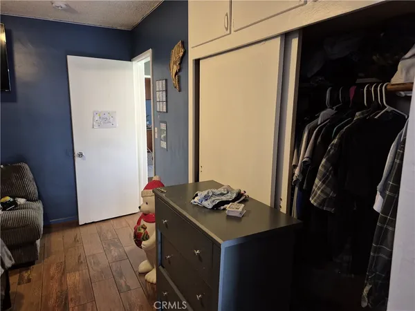 a bedroom with bed and a window