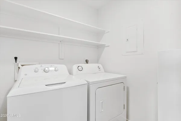 a utility room with dryer and washer