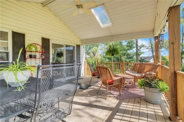 a view of a patio with table and chairs and potted plants